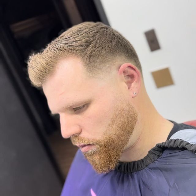 Classic textured side part with a shaped beard